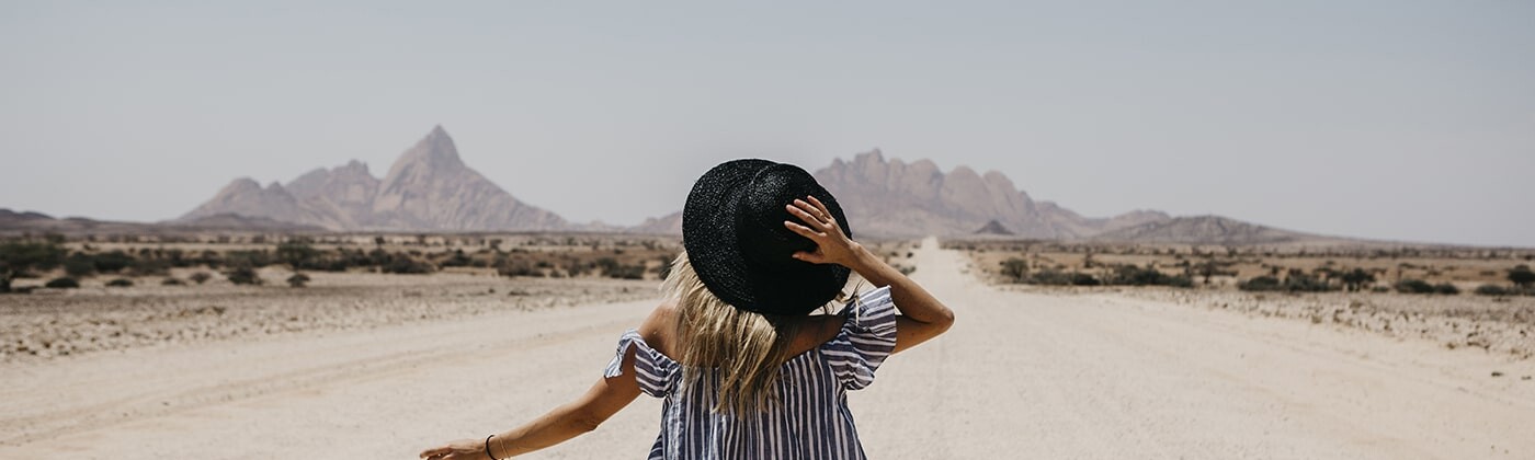 Woman walking on a journey through the desert