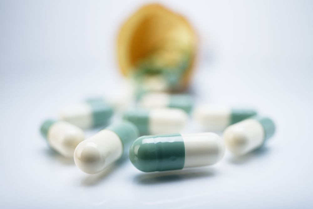 Green and white colour capsule pills
