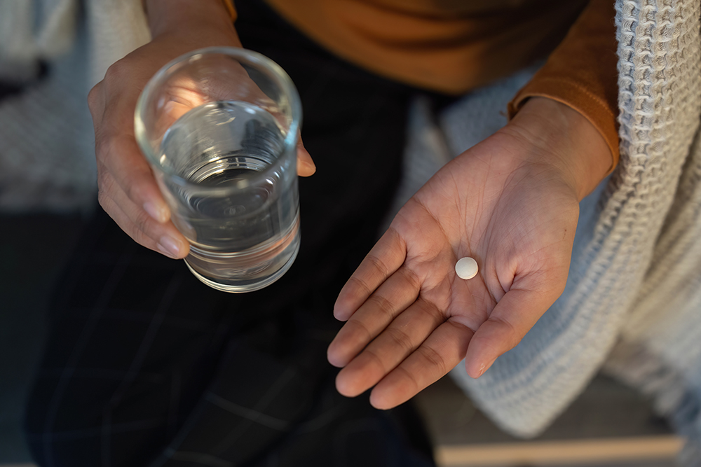 tylenol and glass of water