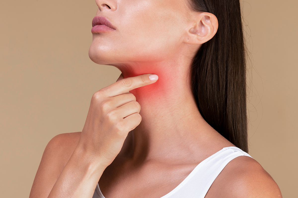 woman with thyroid inflammation