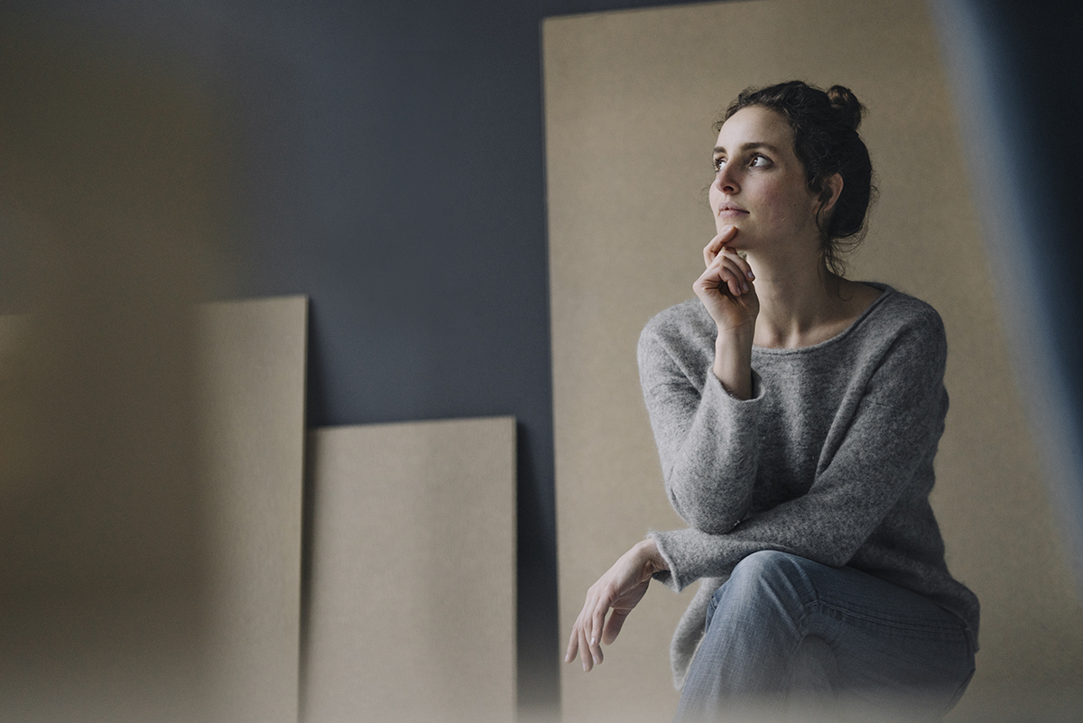 Woman wondering what Is HS (Hidradenitis Suppurativa) and What Causes It