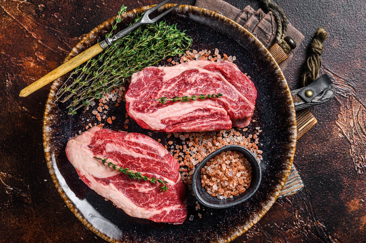 raw meat, salt and herbs for the carnivore diet